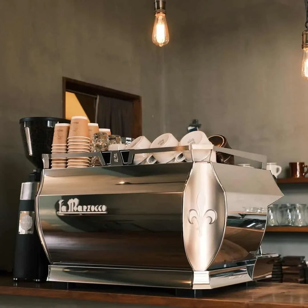 A La Marzocco espresso machine on a café counter, ready for a house blend tasting